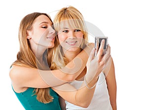 Two teenage girls photographing on camera