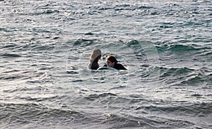 Two teenage girls in the sea photo