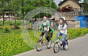 Pengzhou, Chin: Teenaged Girls Bicycling