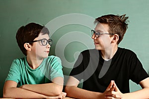 Two teenager boys in myopia glasses close up