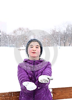 Two teenager girl on the snowy white background