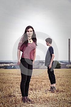 Two teenager on a harvested field