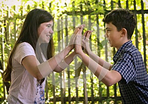 Two teenager siblings boy and girl close up photo