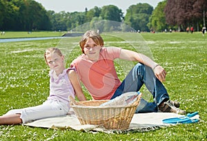 Two teenager siblings at picnic