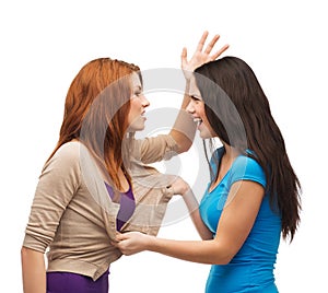 Two teenagers having a fight and getting physical