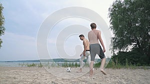 Two teenagers playing football competition between people friends have a fun together spending time outdoors active