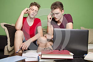 Two teenagers troubleshooting together studying