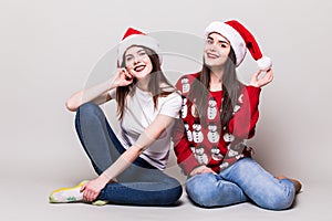 Two teenegers girls in santa hat