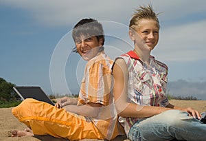 Two teens with laptops