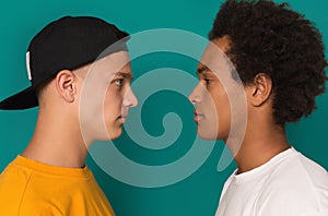 Two teens looking at each other after conflict