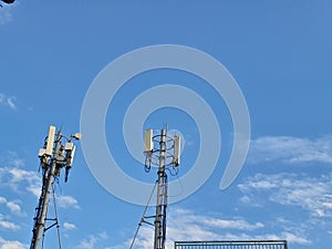 two telecommunication network towers in the blue sky which looks so beautiful and amazing