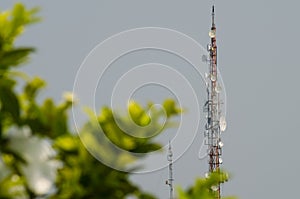 Two telecommunication towers and blue sky