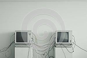 Two televisions are connected to each other in a room, creating a visual display of interconnectivity, Computers connected by photo