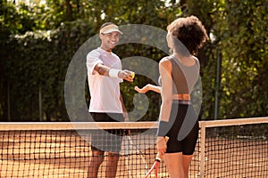 Two tennis payers having a game and looking involved photo