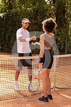 Two tennis payers having a game and looking involved photo