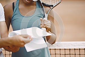 Two tennis players reading a rules before the match