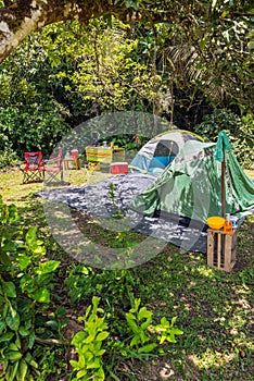 Two tents camping site in tropical forest