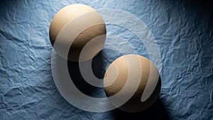 Adds contrast to the smooth spheres emphasizing their shape and