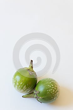 Two Thai eggplants Solanum melongena food ingredients, isolated on white