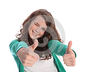 Two thumbs up for success by smiling teenager girl