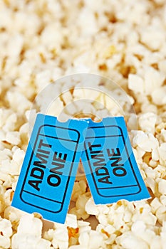 Two tickets on popcorn background