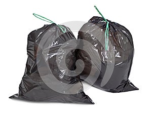 Two tied garbage bags on white