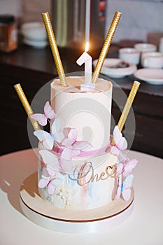 Two-tier butterfly cake for a girl's first birthday.