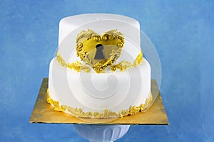 two tier white cake with gold lace and key hole. for 21st birthday theme