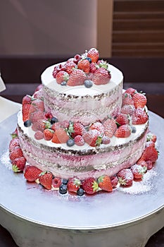 Two-tiered original cake with lots of strawberries