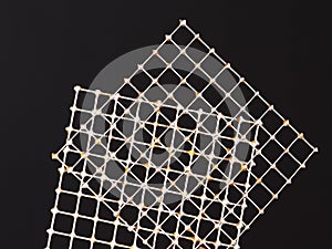 Two tin wire grids with practice solder joints