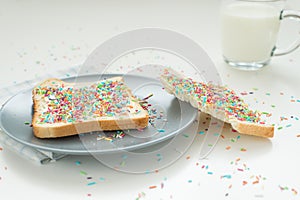 Two toasts with colorful sprinkles