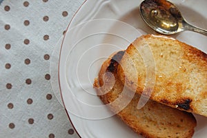 Two toasts with honey on dish