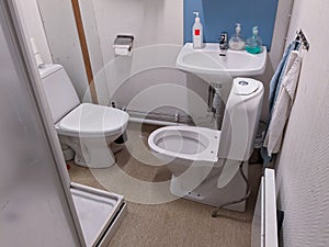 two toilets inside a restroom