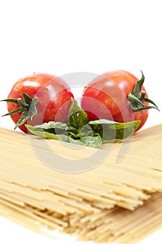 Two tomatoes and basil