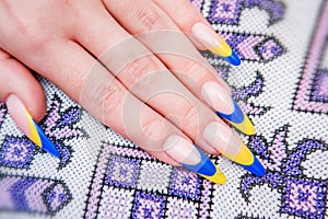 Two tone manicure with blue and yellow varnish