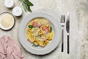 Two-tonned stuffed pasta - tortelloni with ricotta and red radicchio