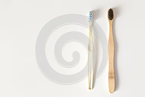 Two toothbrushes on white with copy space. Plastic non-degradable and zero waste. Flat lay