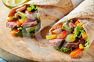 Two tortilla wraps with barbecued entrecote steak