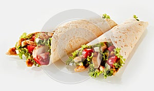 Two tortilla wraps with filling