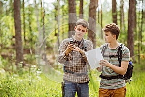 Two tourist determine the route map and navigator