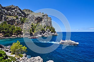 Two tourist ships cruising the coastal sea