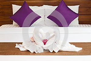 Two Towels on White Bed Sheet