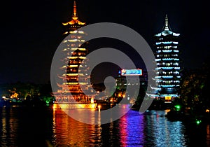 Two towers in night in a lake of Guilin