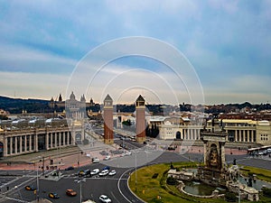 Two towers roundabout fountain font magica de montjuic castle fortress hill Barcelona warm light placa de espanya spain photo