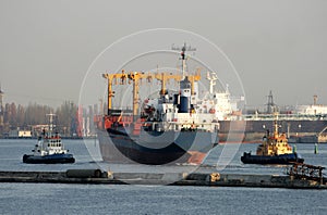 Two tows get the dry-cargo ship