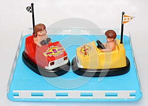 Two toy bump cars in cage