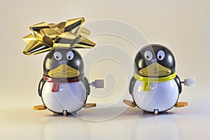 Two Toy Penguins in Holiday Portrait