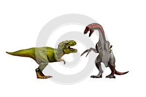 Two toy predator dinosaurs fighting on white background