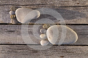 Two traces of pebbles over wooden planks