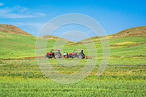 Two tractors in the agricultural fields in Iran